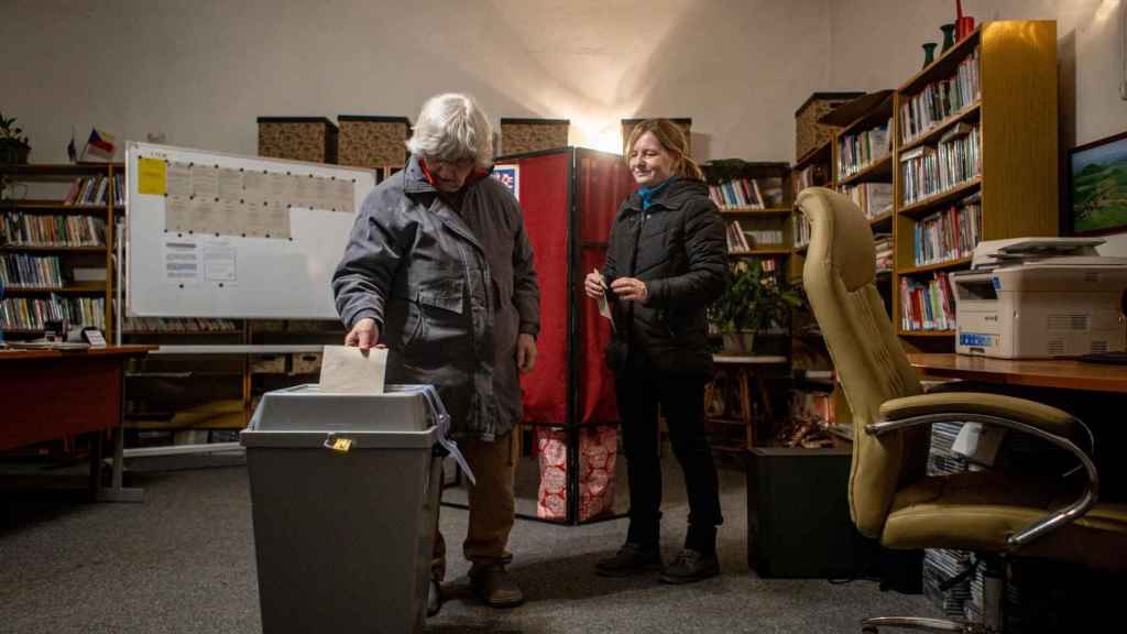 Two women vote in the city of Ledcica for the elections in the Czech Republic.