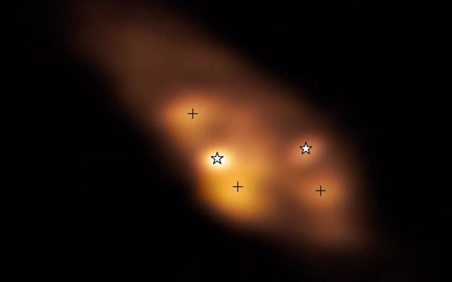 A detailed look at the young binary stars (marked with star symbols) of the IRAS 16293-2422 system.  The three hot spots (marked with crosses) are probably heated by collisions and not by the protostars themselves.