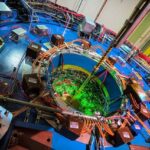The house-sized STAR detector in the Relativistic Heavy Ion Collider (RHIC) acts as a giant 3D digital camera to track particles emerging from particle collisions at the center of the detector.