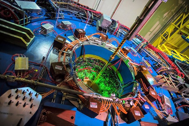 The house-sized STAR detector in the Relativistic Heavy Ion Collider (RHIC) acts as a giant 3D digital camera to track particles emerging from particle collisions at the center of the detector.