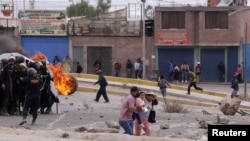 In Photos: Clashes between police and protesters escalate in Peru