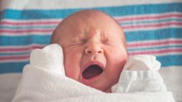 newborn baby yawning