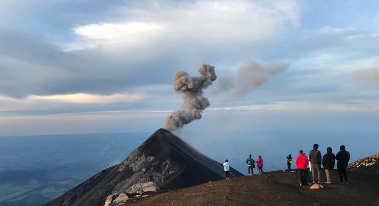 Tourists watch the eruption of Volcán de Fuego in Acatenango, Guatemala