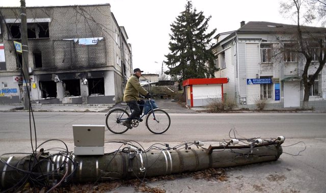 A man on a bicycle in Izium, near Kharkiv, in eastern Ukraine