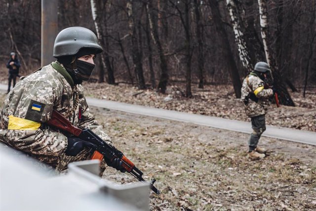 File - A soldier of the Ukrainian army observes his position, on March 6, 2022, in Irpin (Ukraine)