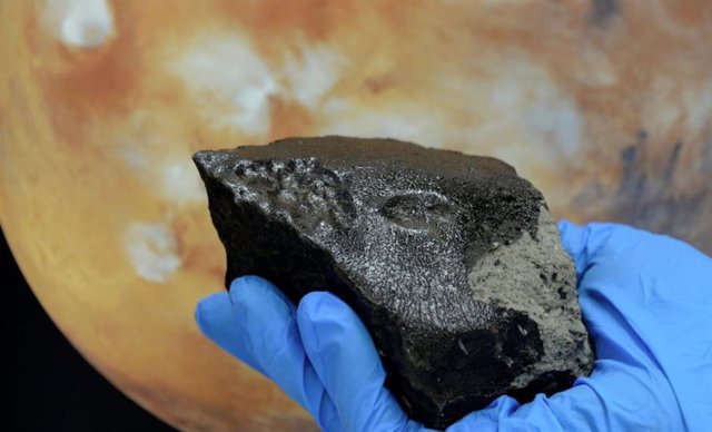 Photograph of the Tissint meteorite, courtesy of Kurt Kracher, Natural History Museum, Vienna.