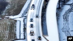 An icy mix blankets the 114 Freeway on Monday, January 30, 2023 in Roanoke, Texas.  Dallas and other parts of North Texas are under a winter storm warning through Wednesday.