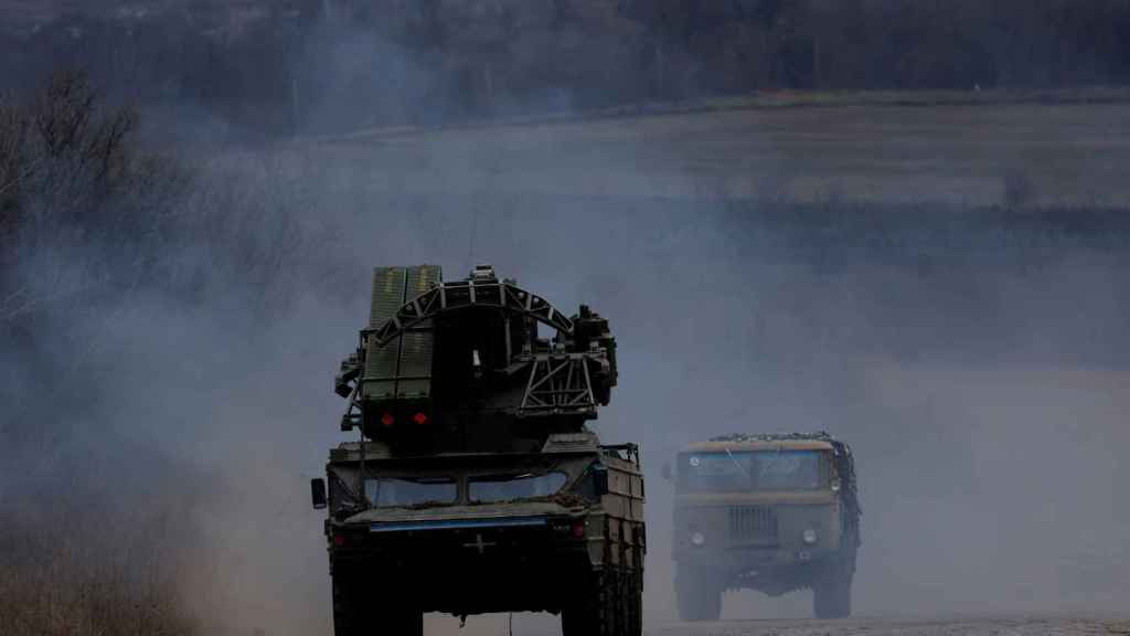 Military vehicles drive towards Donbas.