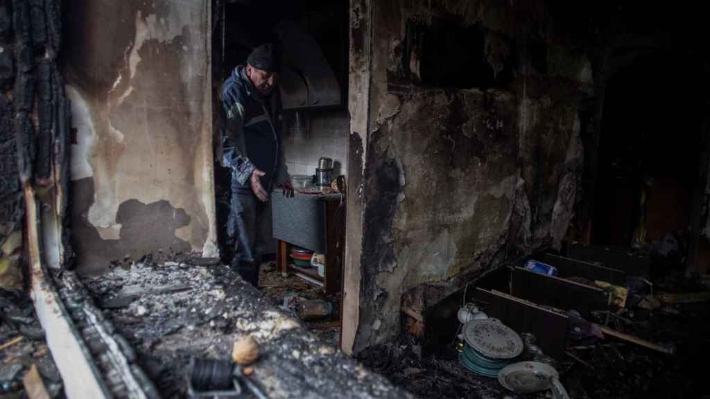 A Ukrainian man, in his destroyed house in Kostiantynivka