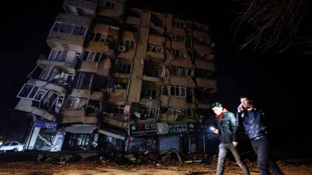 Two people walk through the streets of the city of Antakya, in the province of Hatay (Turkey).