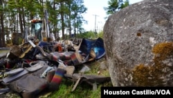 Clothes, junk and debris at the scene of the bus accident in Panama