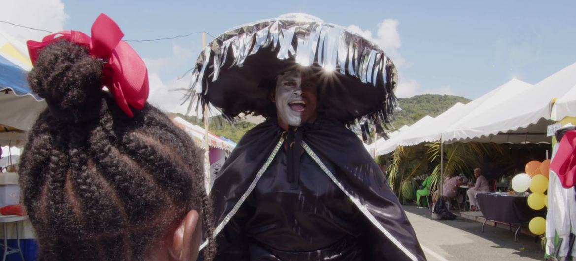 Midnight Thief Kurt Layne shares information on COVID safety protocols at the Tobago Carnival festival.