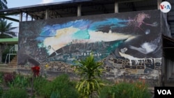 Mural that evokes the era of rubber exploitation that depended on indigenous labor, in La Chorrera, Amazonas, Colombia, on January 26, 2023.