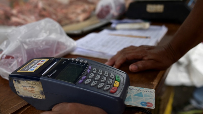 For Venezuelans, credit cards that were once lifesavers are now "useless" by inflation