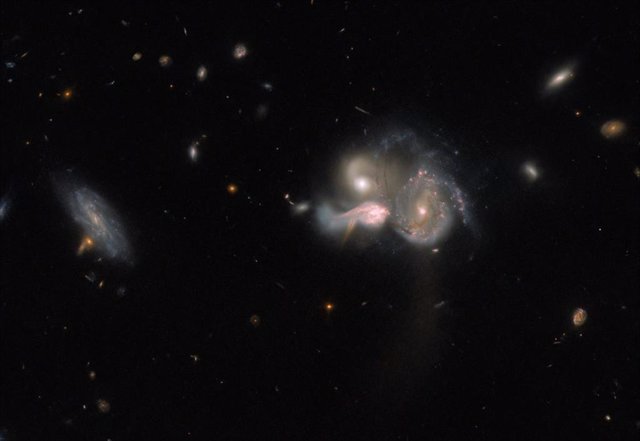 Hubble observes a triple galactic merger