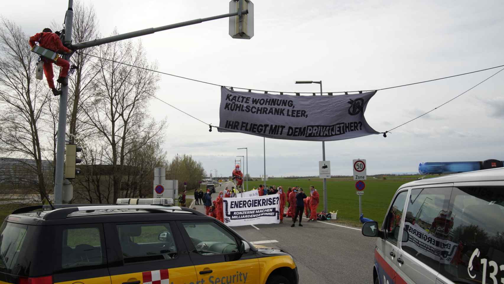 A group of environmental activists blockade a private flight terminal in Vienna