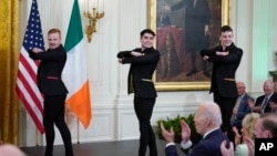 FILE - President Joe Biden and first lady Jill Biden watch the Cairde Irish dance troupe perform at a St. Patrick's Day celebration in the East Room of the White House, March 17, 2022, in Washington.