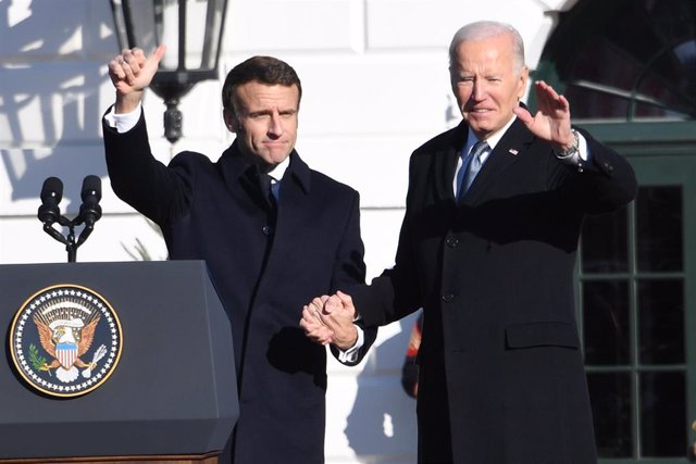 File - The president of France, Emmanuel Macron (I), together with his US counterpart, Joe Biden (R), during a visit in Washington