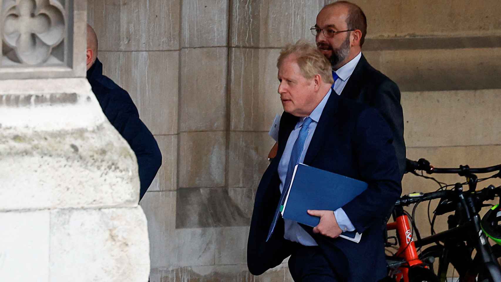 Former British Prime Minister Boris Johnson walks in Parliament in London, Britain, on March 22, 2023.