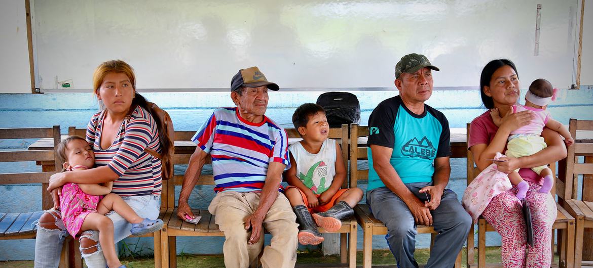 A group of indigenous people wait their turn for a medical evaluation in northern Brazil.