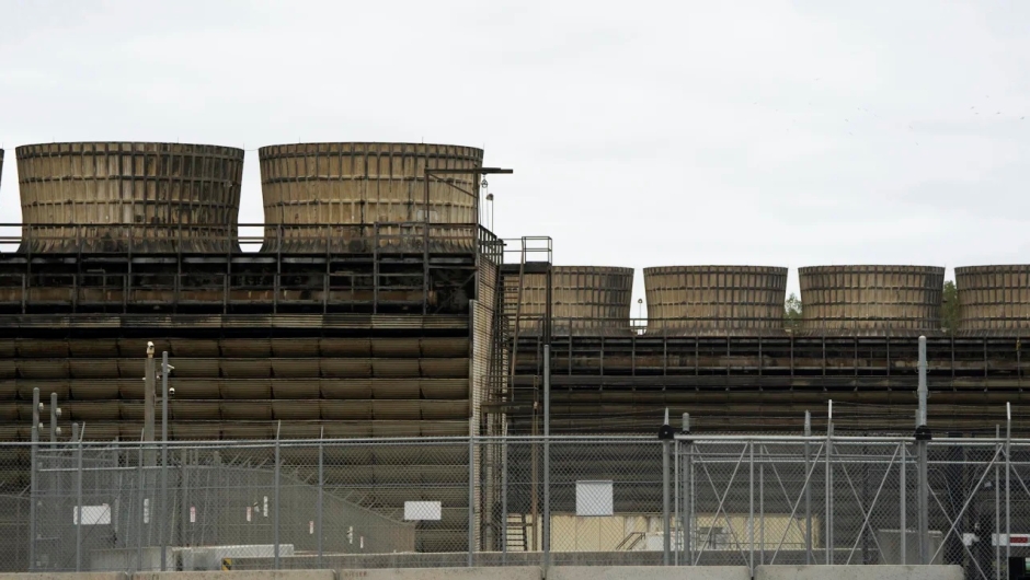 Cooling towers release heat generated by boiling water reactors at the Xcel Energy Nuclear Power Plant on October 2, 2019, in Monticello, Minnesota.  The plant closes Friday for repairs to a radioactive water leak.