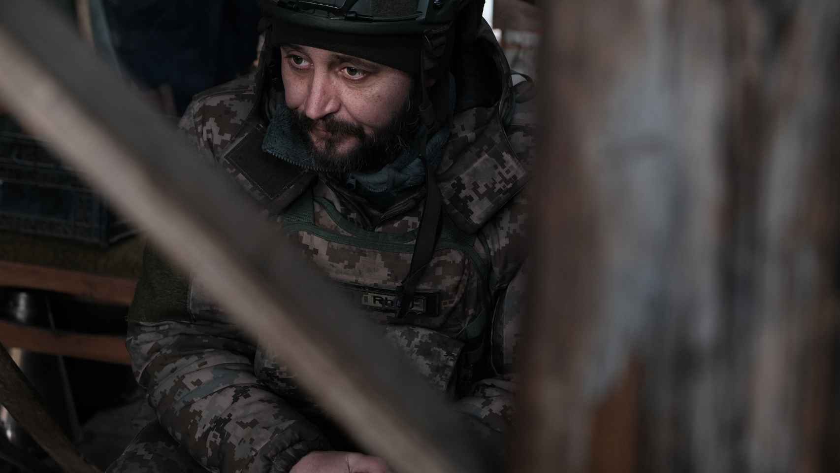 Skif, a member of the Volunteer Army for 9 months, at his post inside a trench in Donbass.