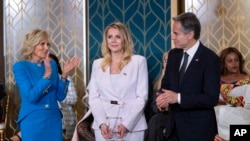 Polish journalist Bianka Zalewska, center, receives the International Women of Courage Award from Secretary of State Antony Blinken, right, and First Lady Jill Biden, left, at the White House in Washington on June 8. March 2023.