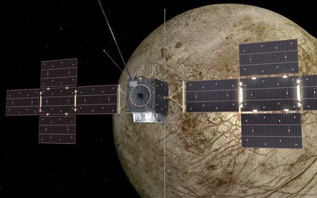 Artist's impression of Juice flying over the moon Europa