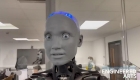 A humanoid robot answers questions and expresses emotions