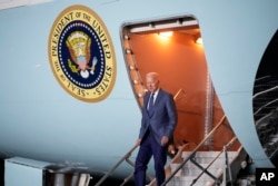 President Joe Biden steps off Air Force One at Belfast International Airport in Belfast, Northern Ireland, Tuesday, April 11, 2023.