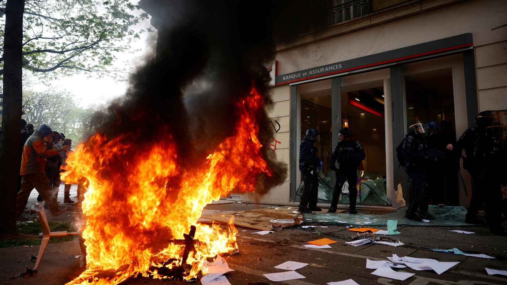 Protesters have set fire to bank branches in Paris.