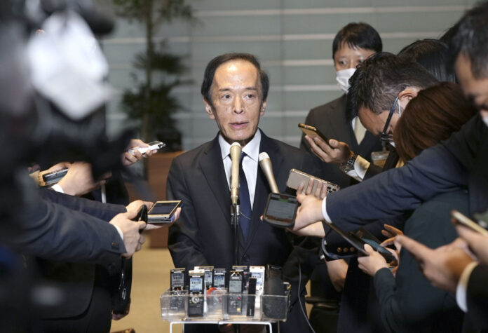 New Bank of Japan chief backs current policies