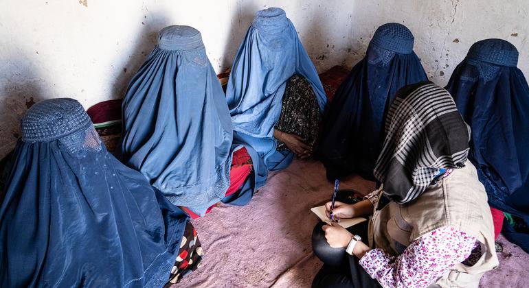 An official from the United Nations Office for the Coordination of Humanitarian Affairs meets with displaced women in eastern Afghanistan.