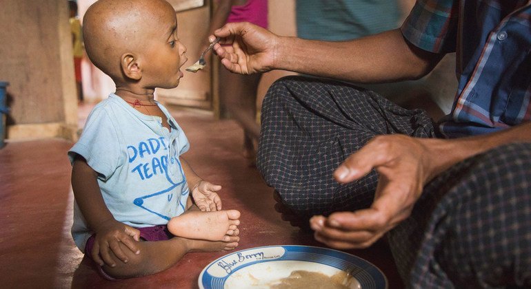 A child is fed in Cox Bazar, Bangladesh.  COVID-19 may increase world hunger.