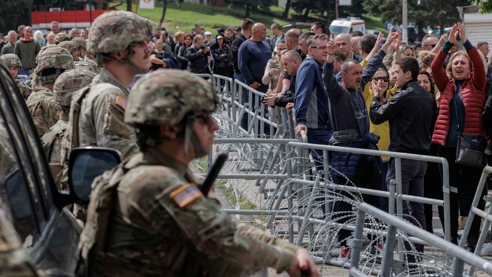 Hungarian KFOR soldiers guard the entrance to the municipal office in the town of Zvecan.