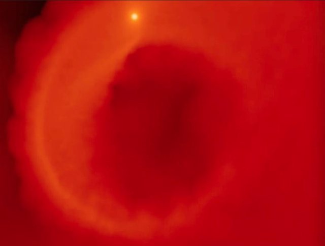 A simulation of the early stages of the process.  A hot Jupiter planet is pushed too close to its star and begins to evaporate, flinging its outer layers into the surrounding disk.