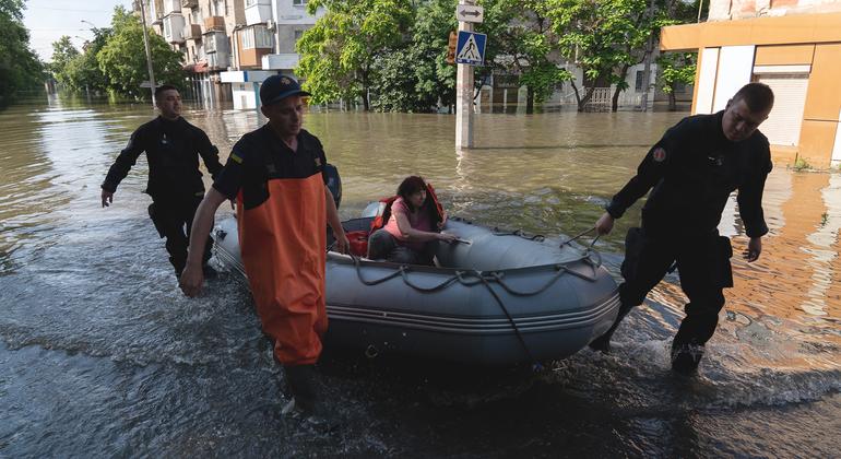 Evacuation of a woman in a flooded neighborhood of Kherson, after the destruction of the Kakhovka dam, in southern Ukraine.