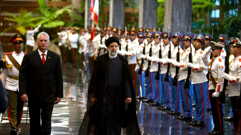 During a visit to Cuba, the Iranian president focuses more on business than on criticizing the US