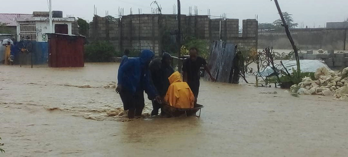 A resident of Cité Soleil in Port-au-Prince, Haiti, is rescued after flooding.