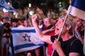 Israeli protesters surround a police station during the interrogation of an activist