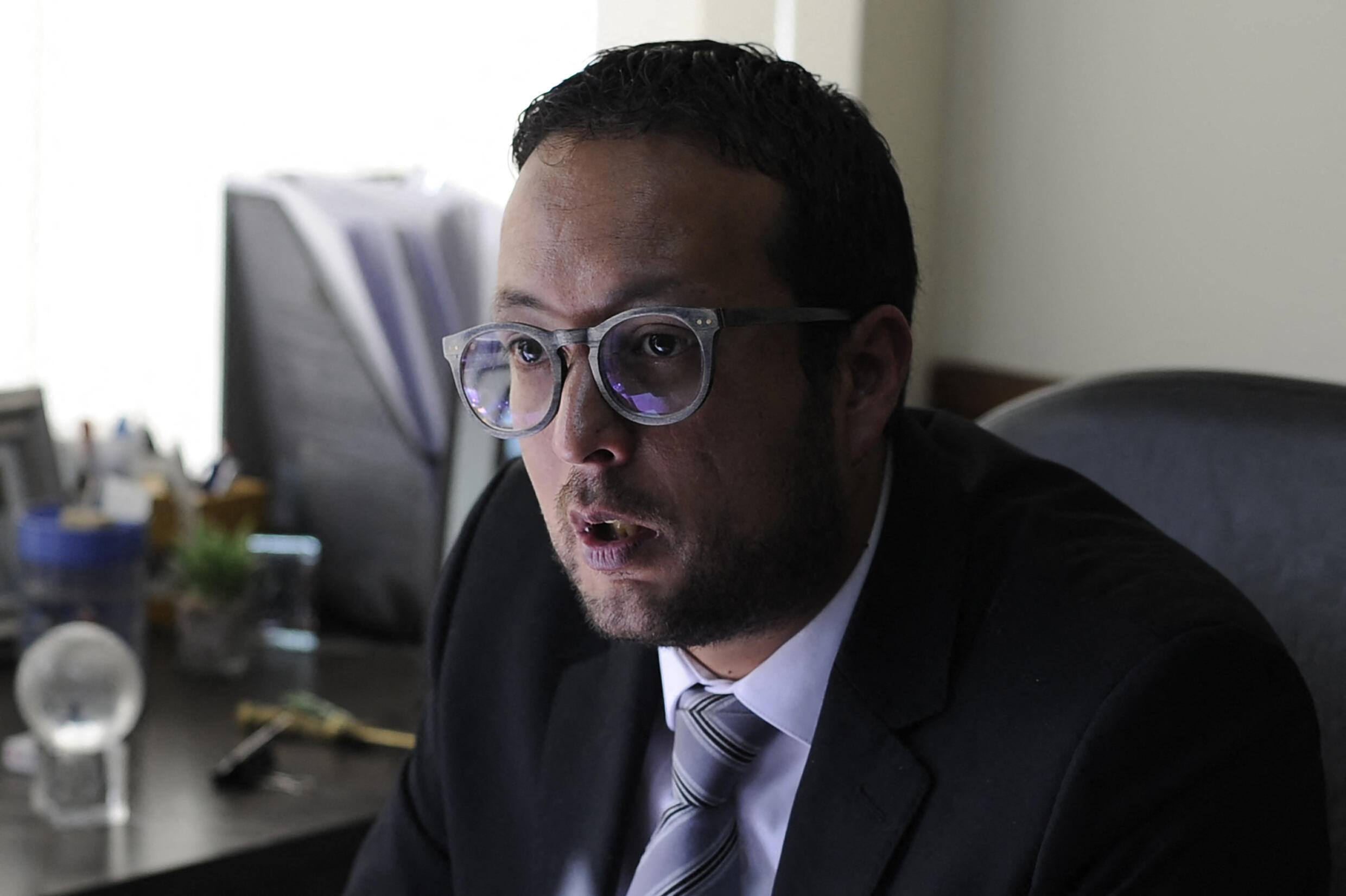 In this file image, Luis Guillén, the lawyer for the former president, Jeanine Áñez, speaks to AFP about his client's case.  Guillén, along with other lawyers, make up the defense team of the former head of state.