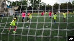 Two makeshift teams of teenagers at the Union School in Port-au-Prince, Haiti, go head-to-head in soccer.  The program seeks to separate them from street violence and perhaps find some high performance.  Photo dated June 5, 2023.