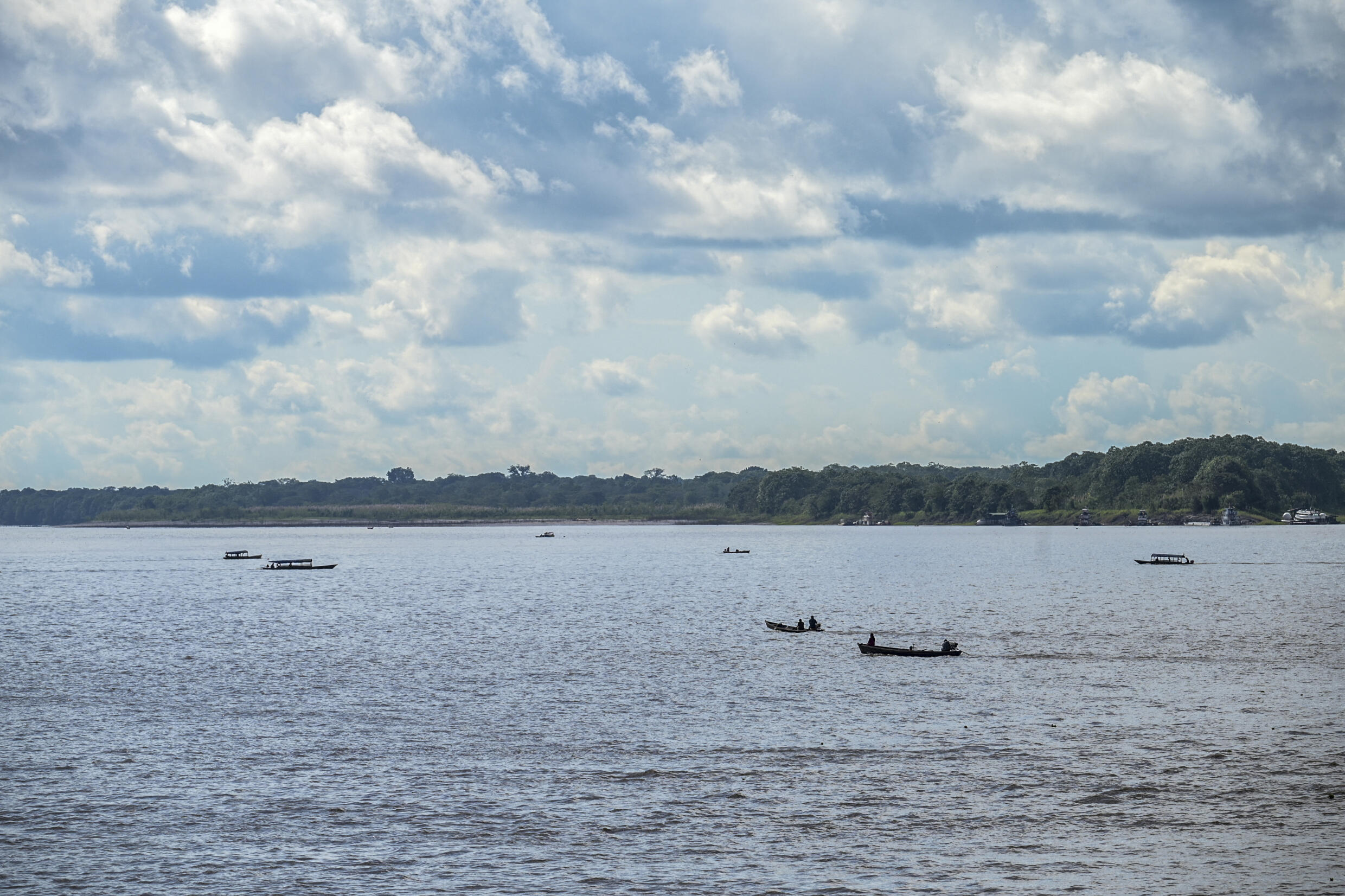 People sail on the Amazon river in Tabatinga, Brazil, on July 7, 2023, on the eve of a summit between Colombian and Brazilian authorities on the protection of the Amazon.