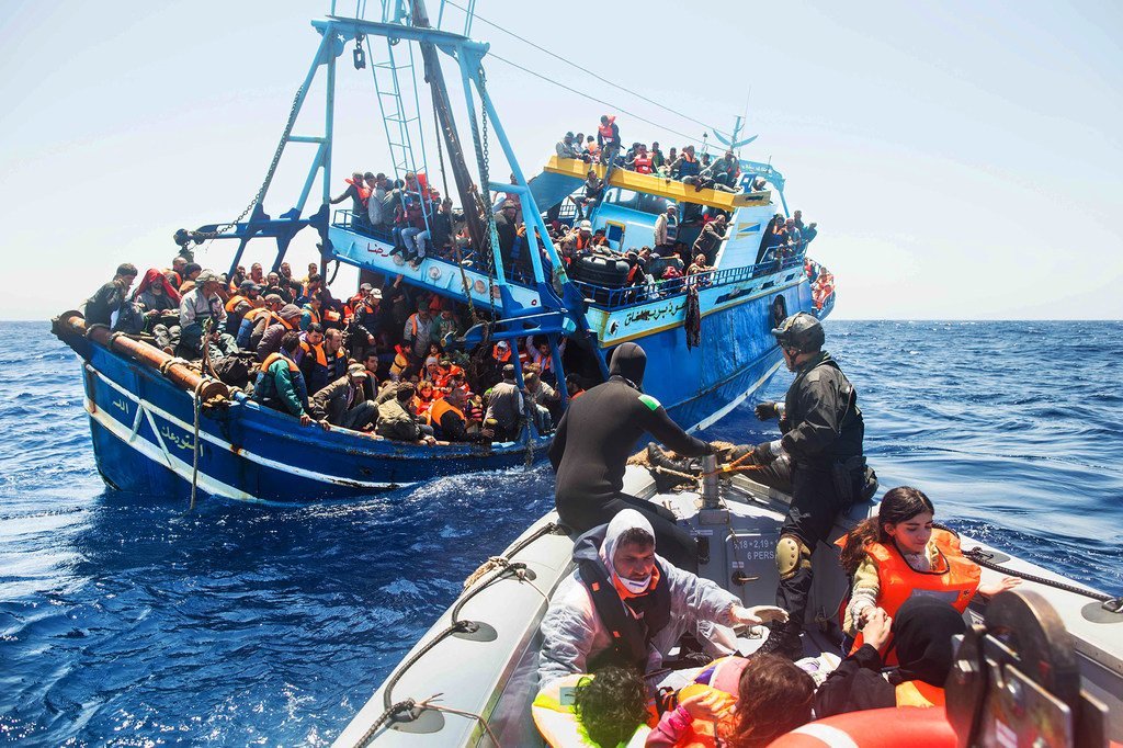 The Italian Navy rescues a group of migrants in the Mediterranean Sea.