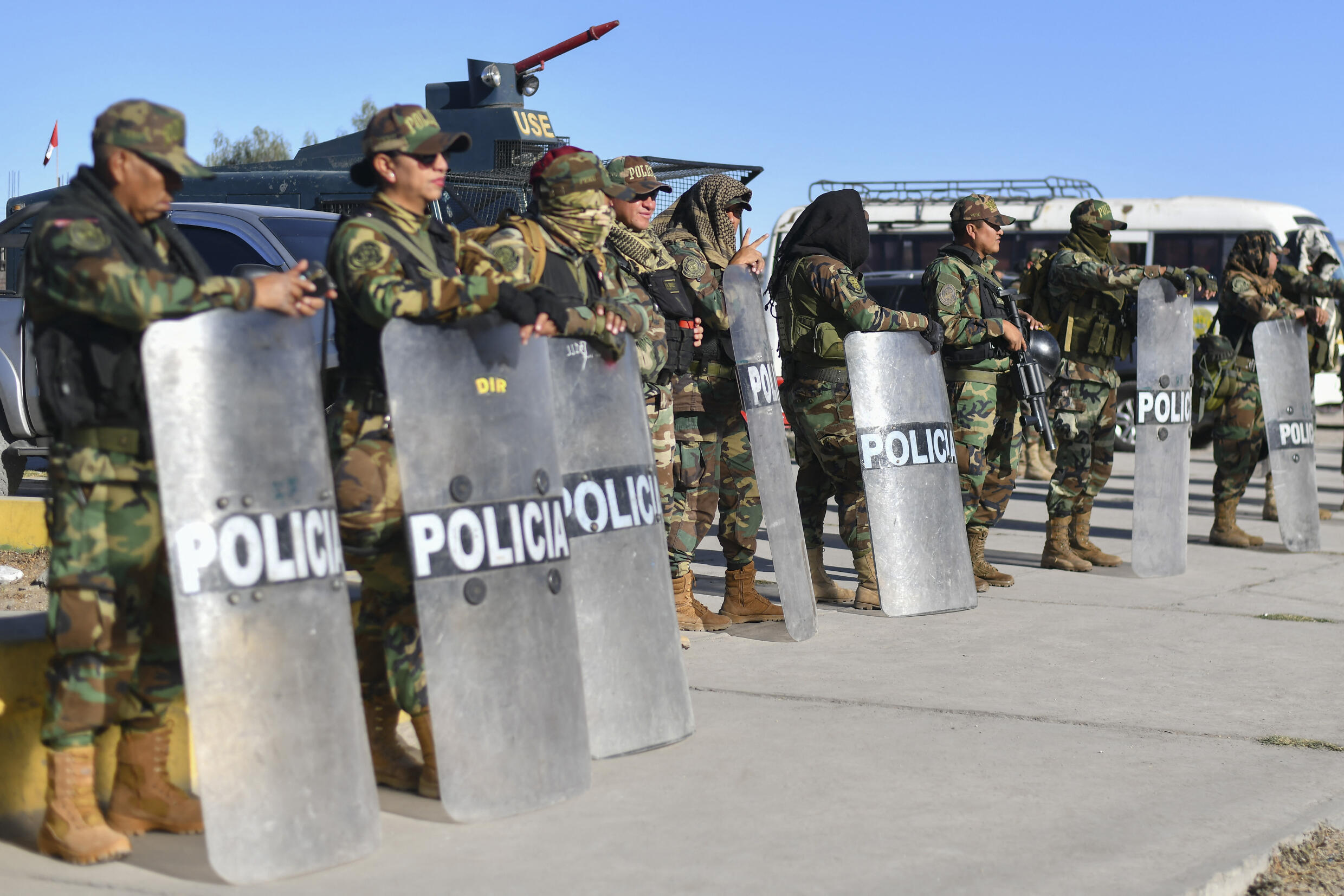 Members of the Peruvian Army and riot police stand guard at the Añashuayco Bridge, located next to the Rodríguez Ballón International Airport, at the start of a national demonstration against Peruvian President Dina Boluarte in Arequipa, Peru, on July 19, 2023.