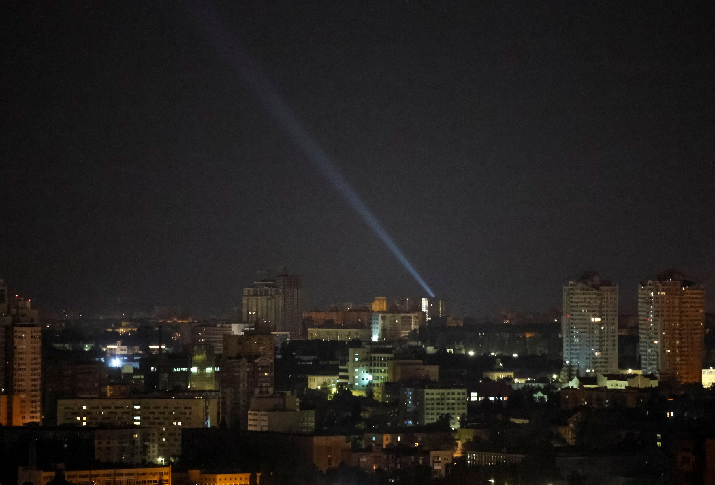 Ukrainian military wear a searchlight as they search for drones in the sky over the city during a Russian-launched drone attack on kyiv, Ukraine, on July 25, 2023.