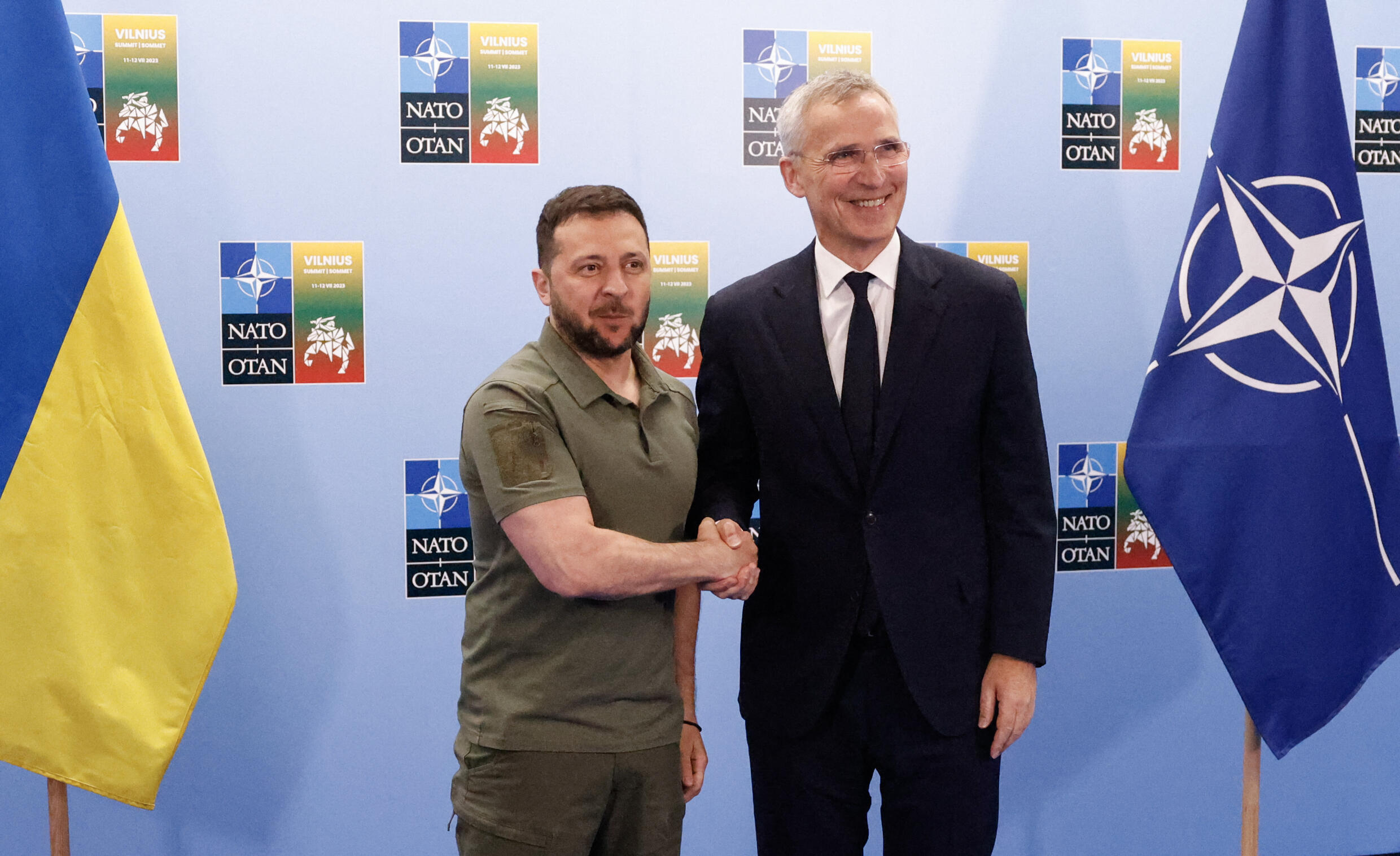 NATO Secretary General Jens Stoltenberg (right) shakes hands with Ukrainian President Volodymyr Zelensky before a joint press conference on the sidelines of the NATO summit in Vilnius on July 12, 2023.