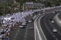 Tens of thousands of Israelis march on the Knesset in a last-ditch attempt to stop judicial reform