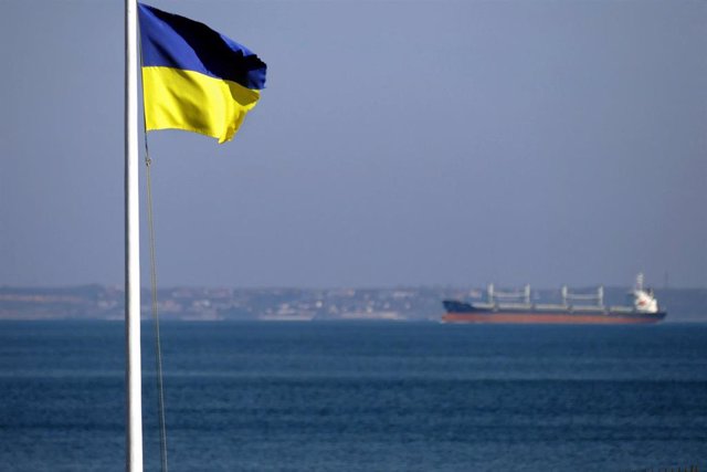 Archive - Ship in Black Sea waters next to the Ukrainian flag