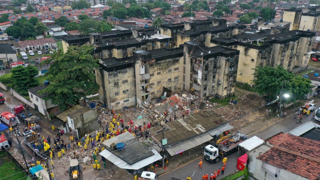 The collapse of a building leaves at least 14 dead in a city in northeastern Brazil